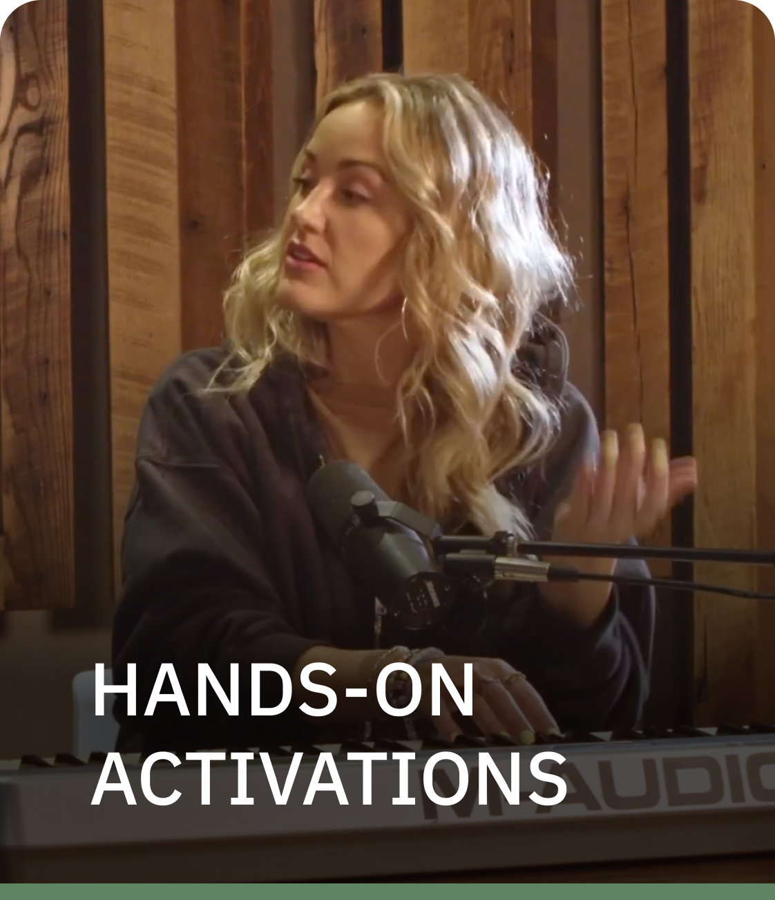 A woman singing into a microphone with the words hands-on activations below her