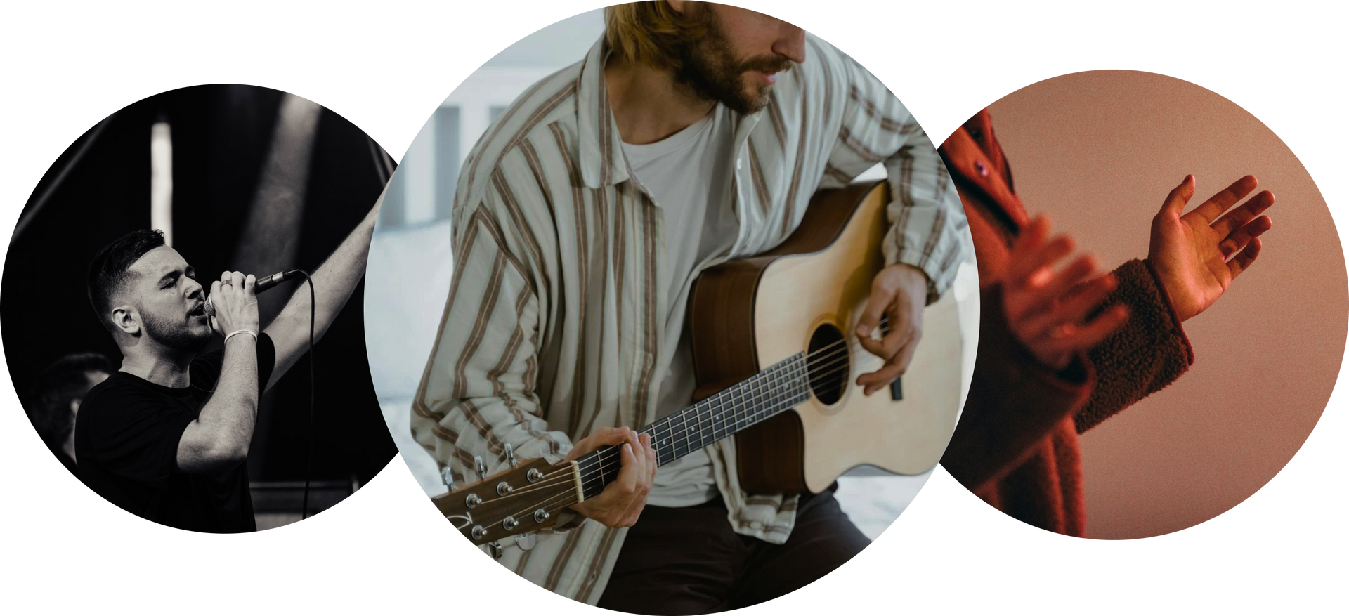 A man is singing into a microphone and playing an acoustic guitar.