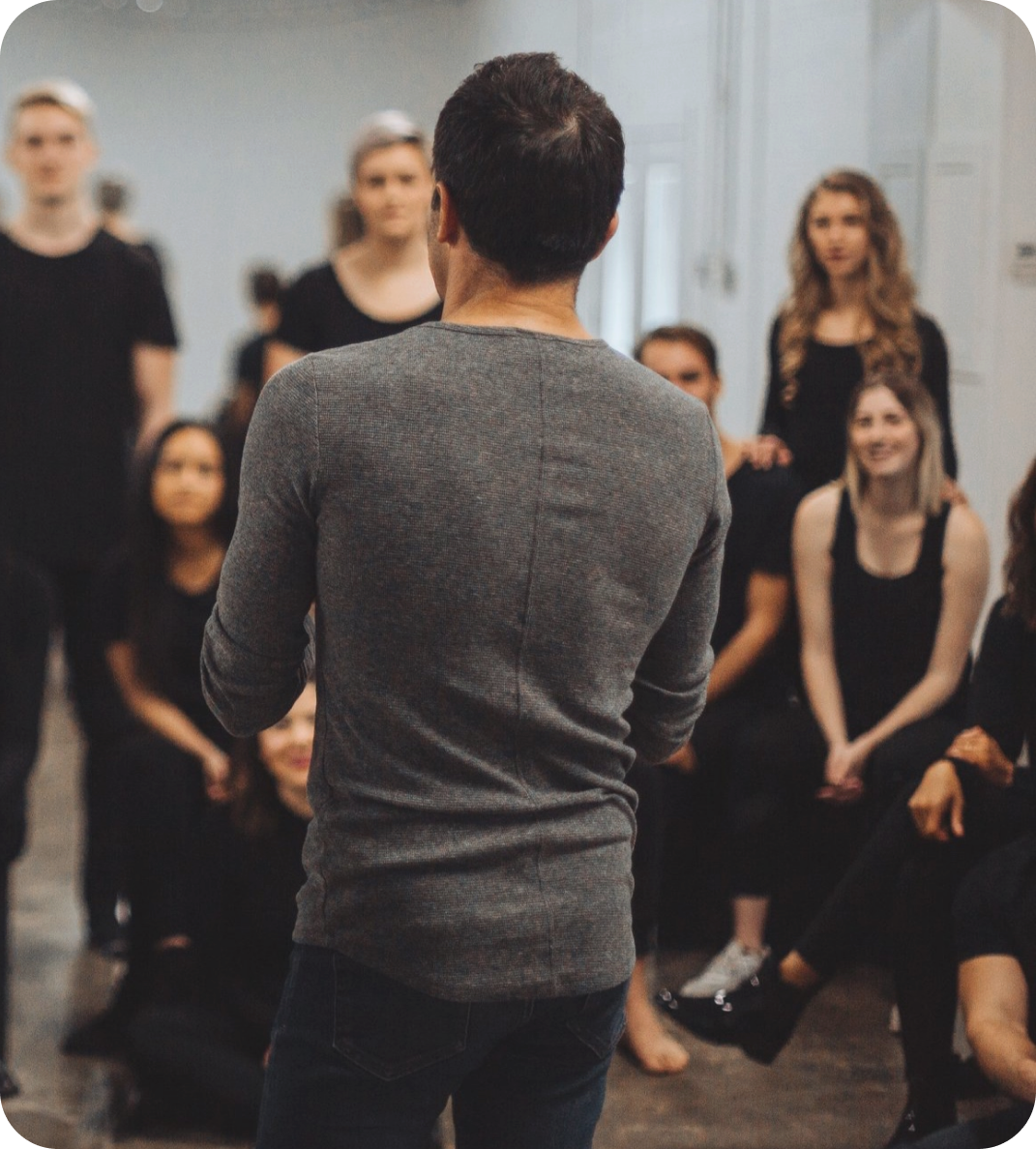 A man is giving a presentation to a group of people