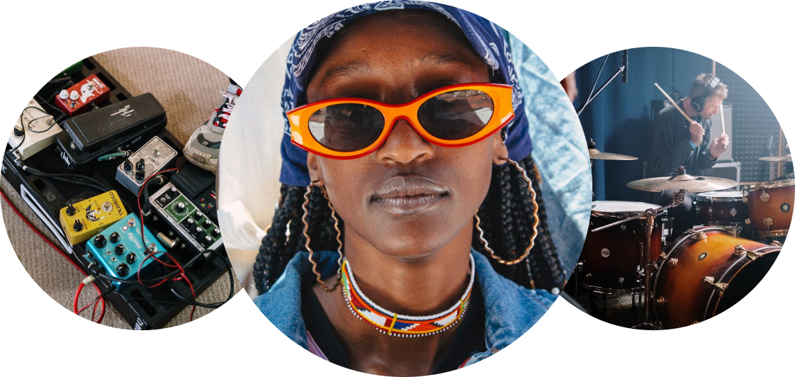 A woman wearing sunglasses and a bandana is standing next to a drum set.