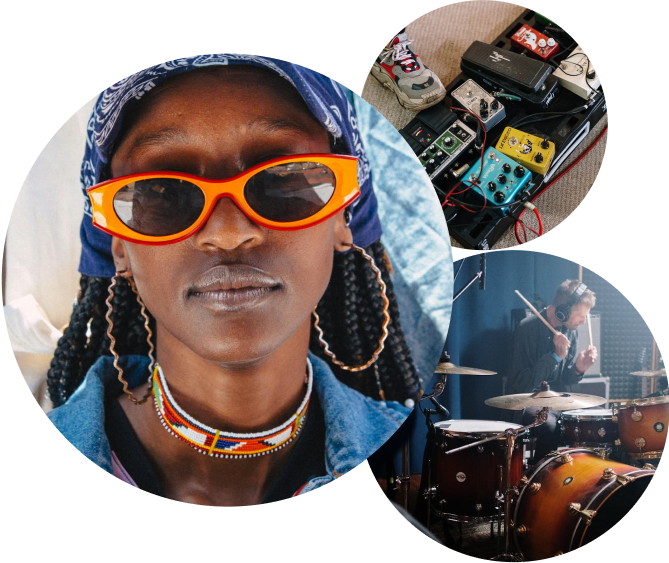 A woman wearing sunglasses and a bandana is surrounded by drums