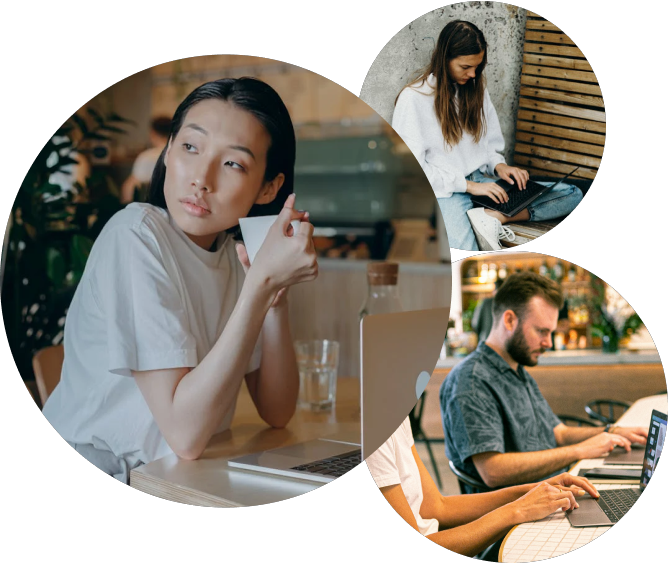 A woman sitting at a table with a cup of coffee and a man sitting at a table with a laptop