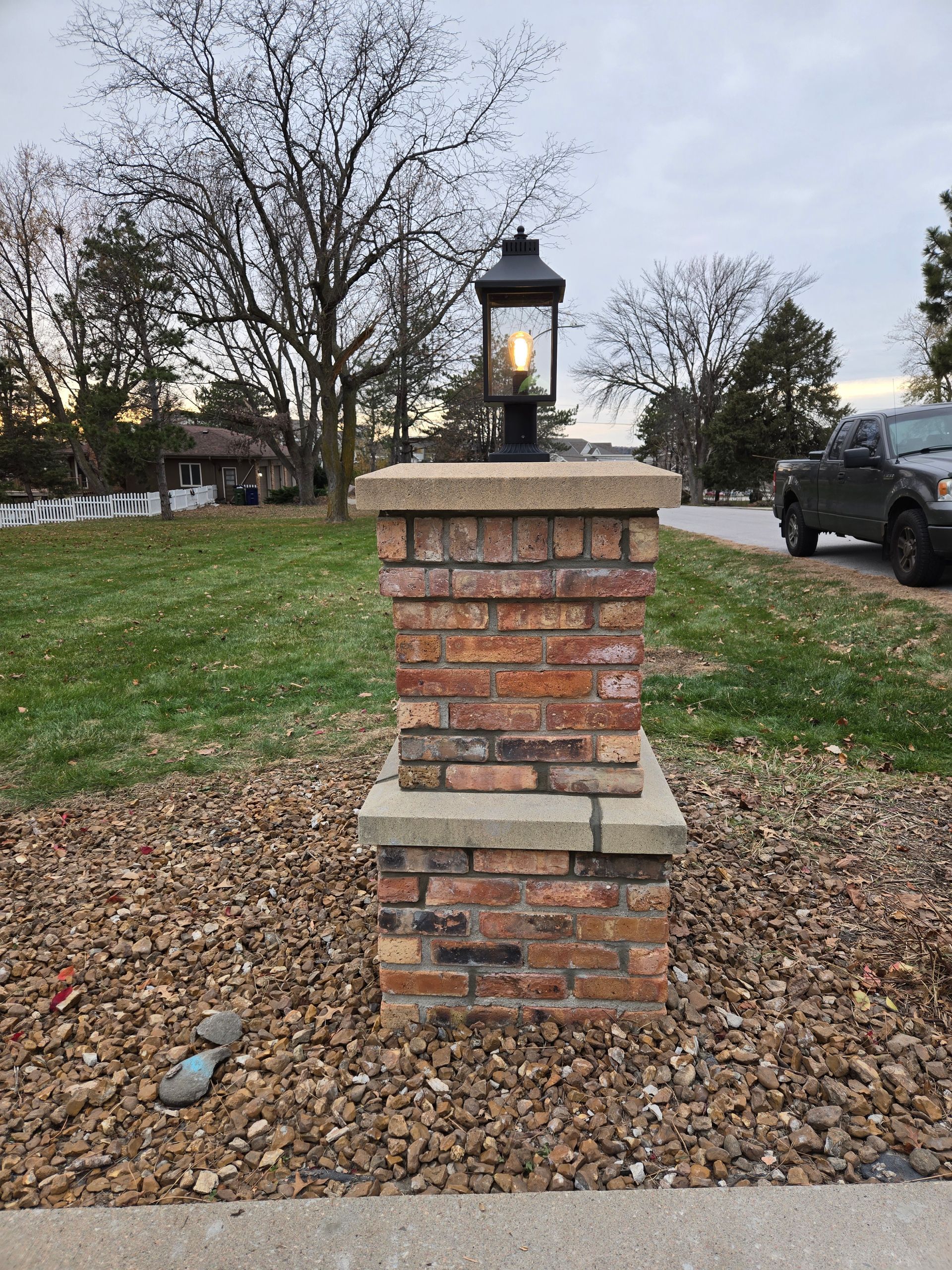 Brick pillar with light on top