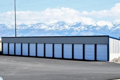 Storage units with a mountain backdrop.