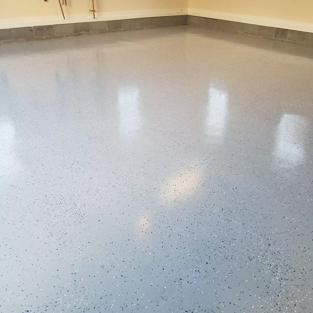 A close up of a shiny concrete floor in a garage.