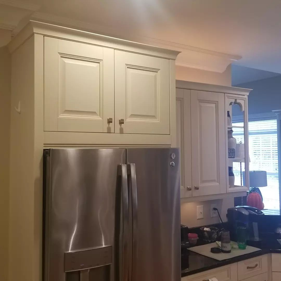 A living room with a wooden floor and a window.