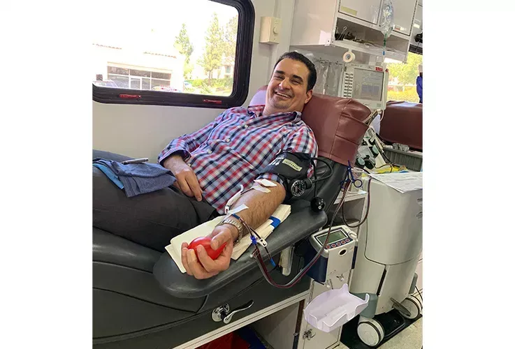 A Del Mar Dental Arts staff person donating blood.