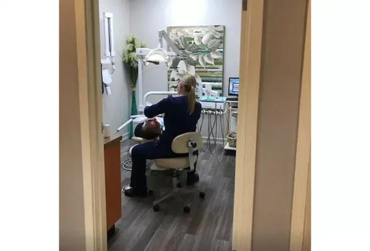 Del Mar Dental Arts staff member in a dental patient room.