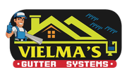 A logo for vielma 's gutters systems with a man on the roof