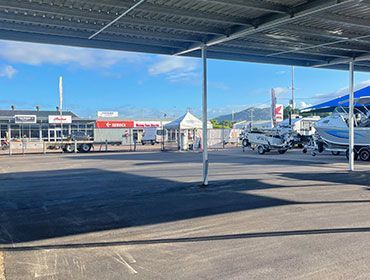 A Parking Lot With A Lot Of Boats Parked Under A Canopy — Elite Bitumen & Asphalt In Mackay, QLD