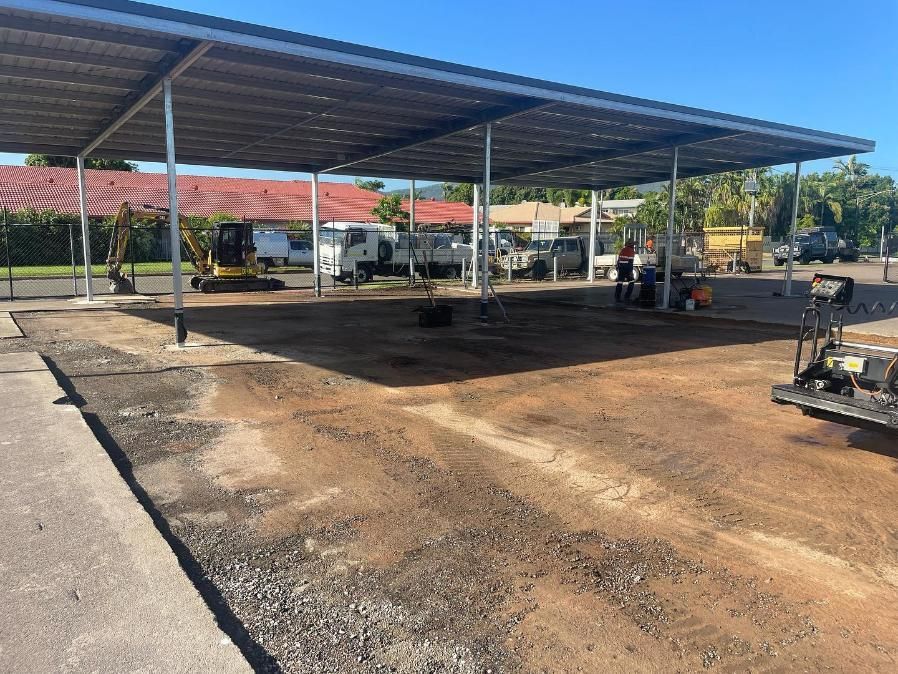 A Parking Lot With A Canopy Over It Is Being Built — Elite Bitumen & Asphalt In Mackay, QLD