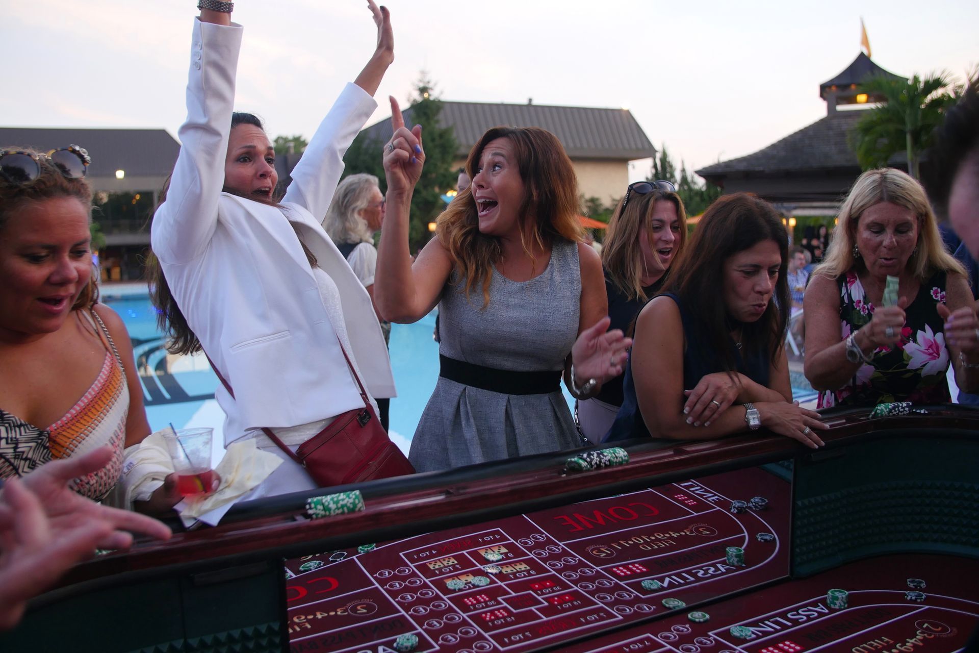 Guests playing at a casino table