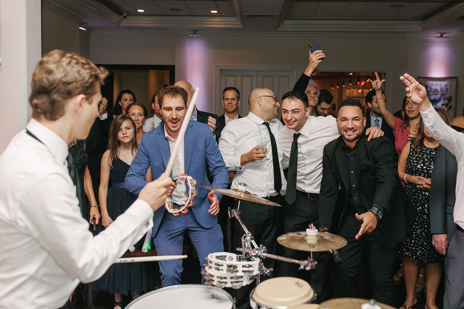 guests drumming at a wedding