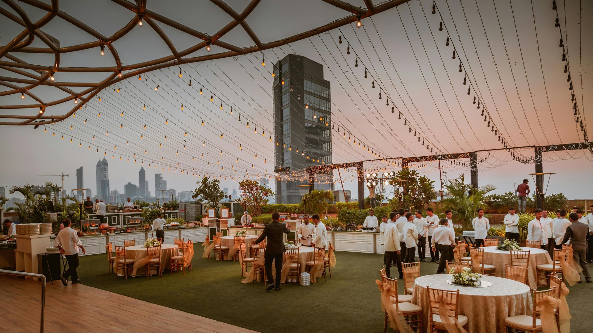 Event setting with banquet tables under a beautiful white tent