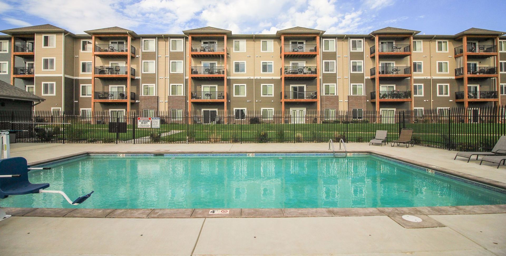 An artist 's impression of a bedroom with a large bed and a walk in closet.