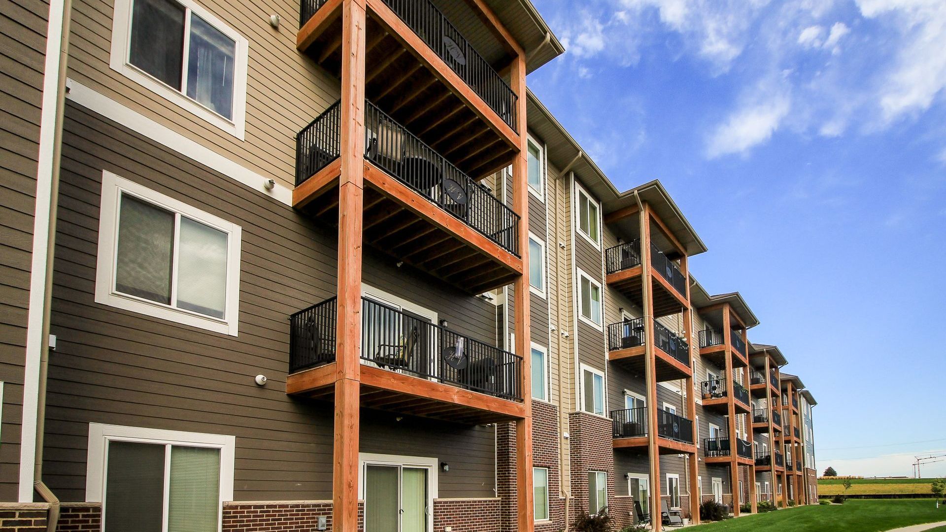 A dining room with a table and chairs and a picture on the wall.