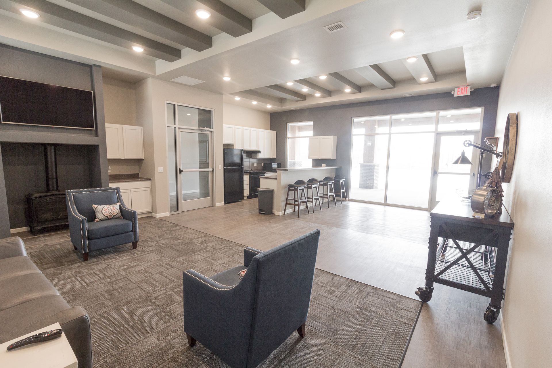 A kitchen with stainless steel appliances and wooden cabinets