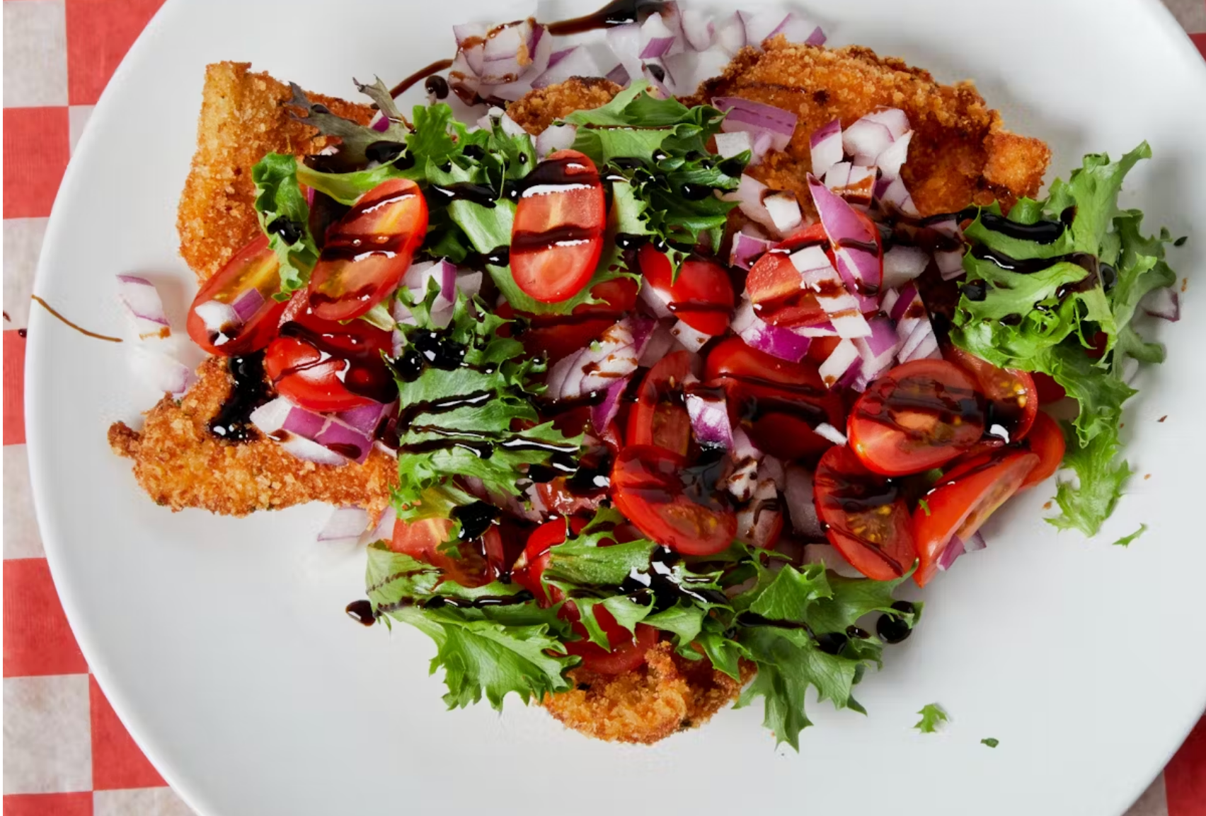 chicken milanese on white plate