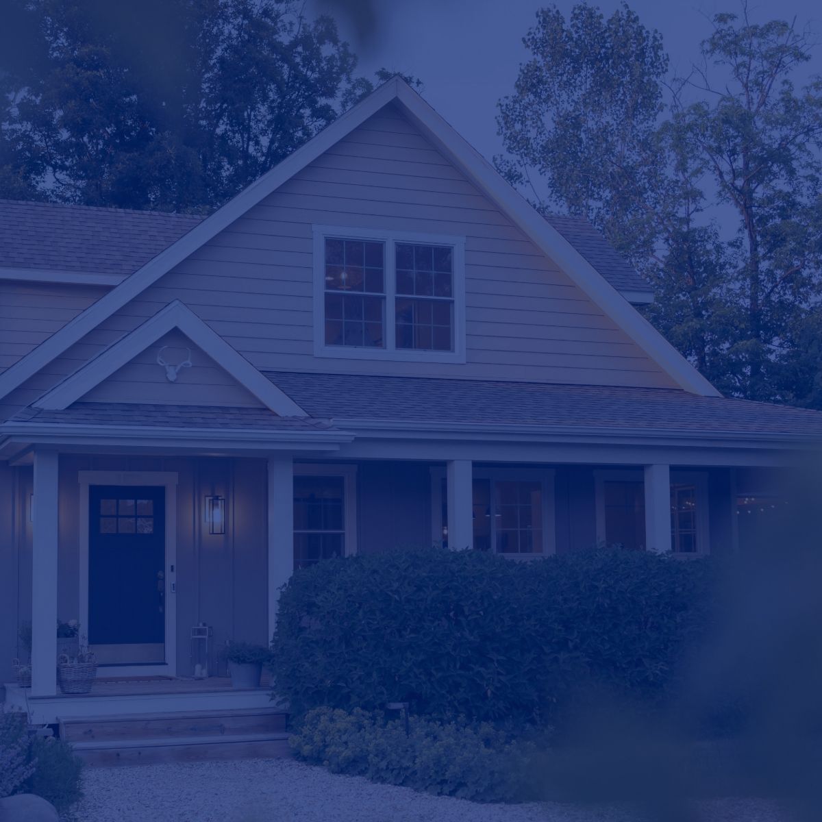 A blue background with a house and trees in the background