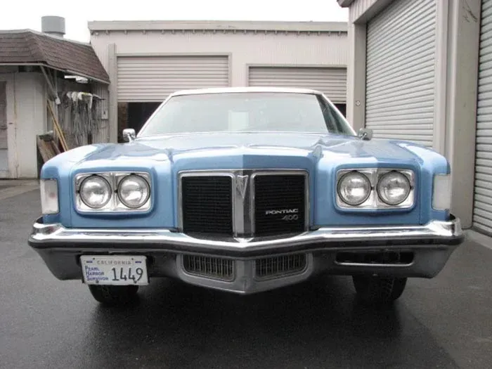 A Blue Pontiac Is Parked In Front Of A Garage — Santa Rosa, CA — Precision Frame and Body Shop