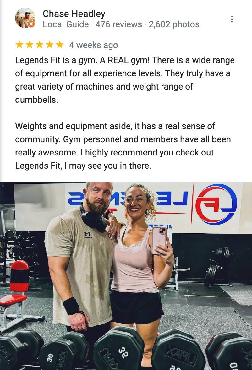 A man and a woman are standing next to each other in a gym.