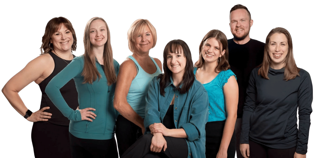 A group of people smiling at the camera, posing together with a white background.