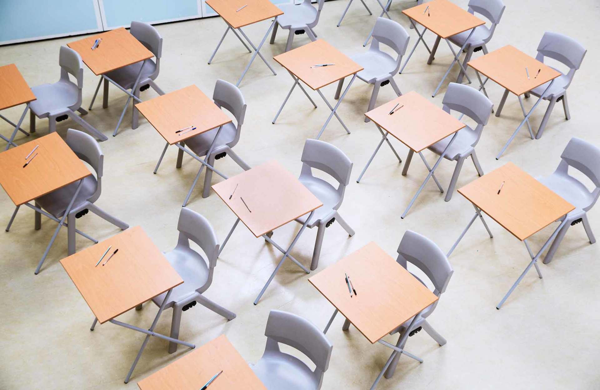 Elevated view of rows of desks and chairs in empty classroom