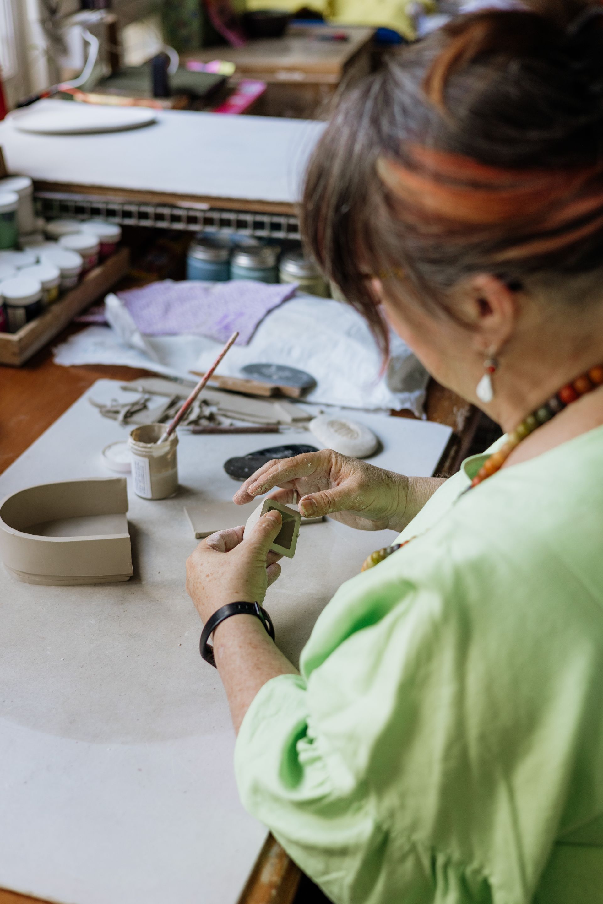 Woman hand building with clay