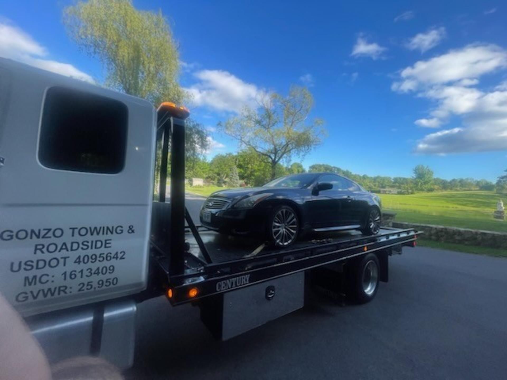 Muddy tire of a white off-road vehicle driving on a muddy forest path. Muddy tire of a white off-road vehicle driving on a muddy forest path.