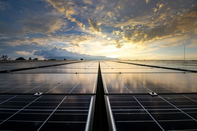 Solar panels under bright sky