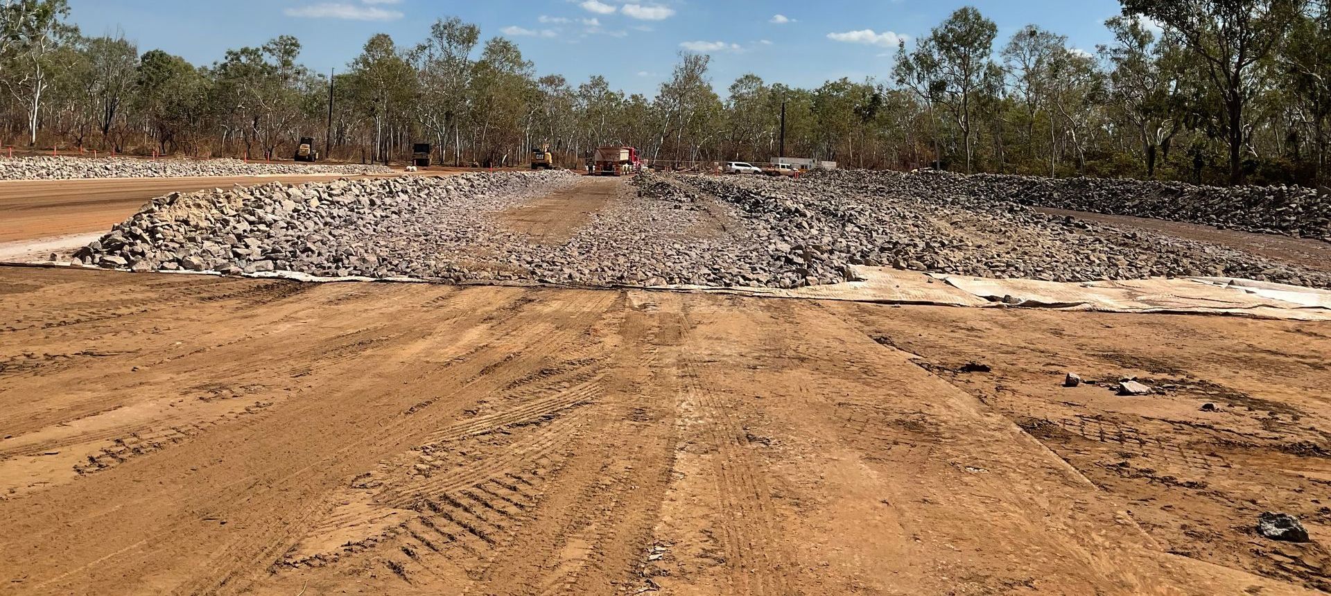 A Bulldozer Is Engaged In Tasks On A Dirt Road — Coleman's Contracting & Earthmoving In Humpty Doo, NT