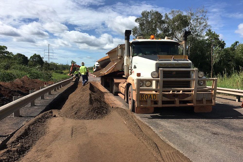 Road Train Truck Unloading Soil For Footpath Construction — Coleman's Contracting & Earthmoving In Dundee Beach, NT