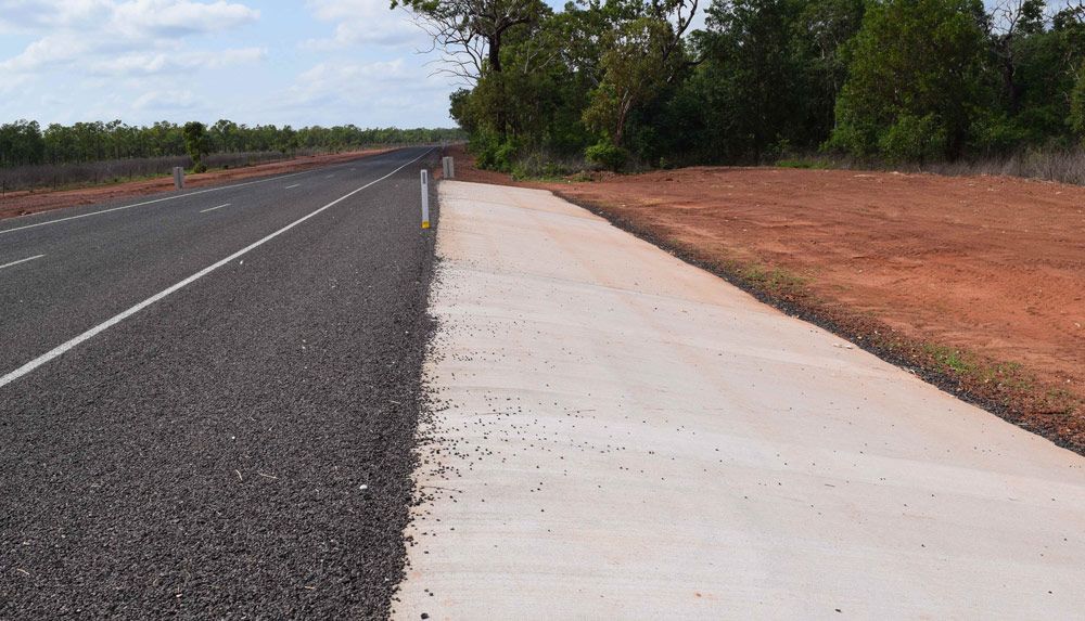 A Newly Constructed Road With A Concrete Sidewalk — Coleman's Contracting & Earthmoving In Humpty Doo, NT 