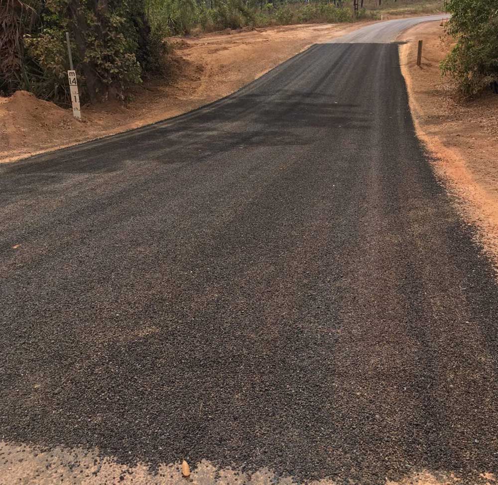 A Road Being Constructed With A Lot Of Gravel On It — Coleman's Contracting & Earthmoving In Humpty Doo, NT