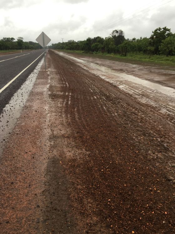 A Muddy Road Besides A Newly Constructed Road — Coleman's Contracting & Earthmoving In Dundee Beach, NT
