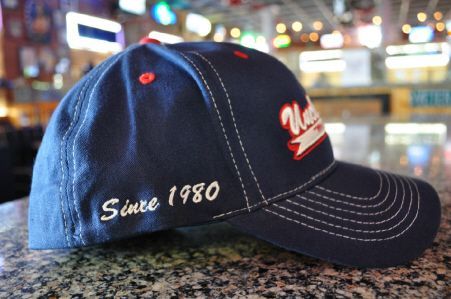 A navy blue baseball cap with white 