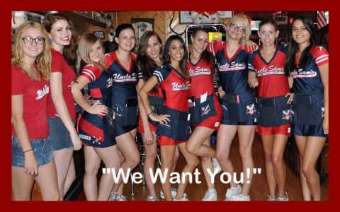 A group of employees in matching red, white, and blue uniforms stand in a restaurant under the caption, 