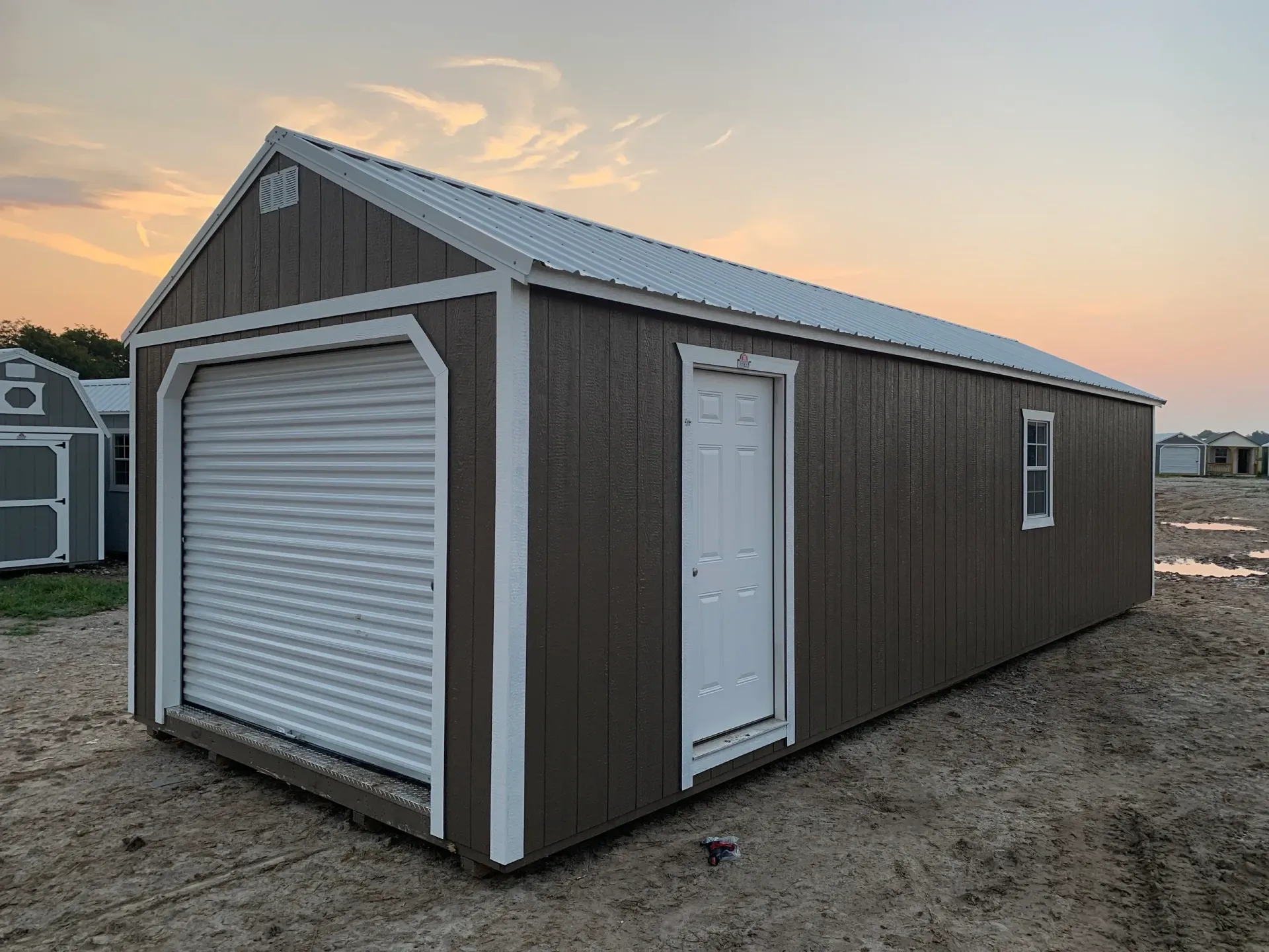 brown shed with roll up door
