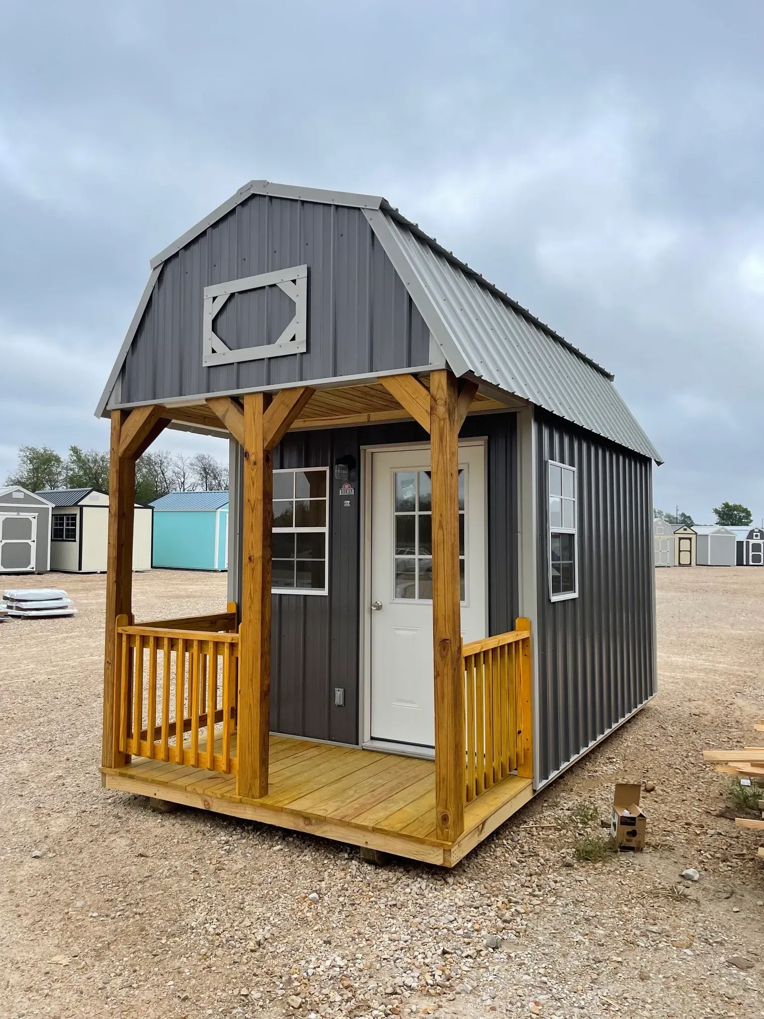 grey shed with porch