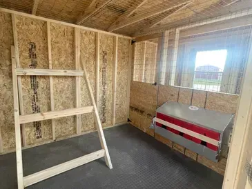 chicken coop with nesting boxes and roosting rail