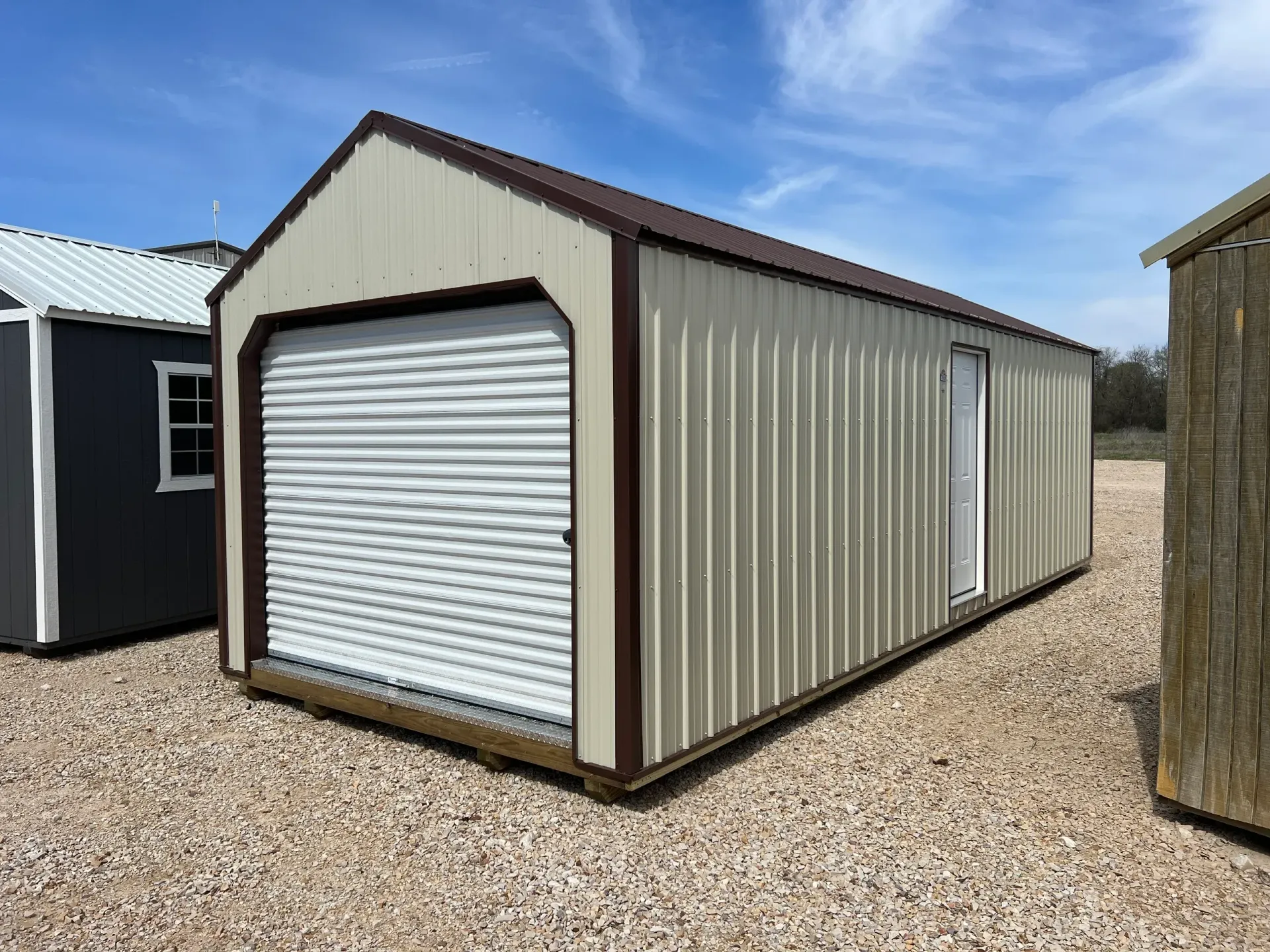 tan shed with roll up door