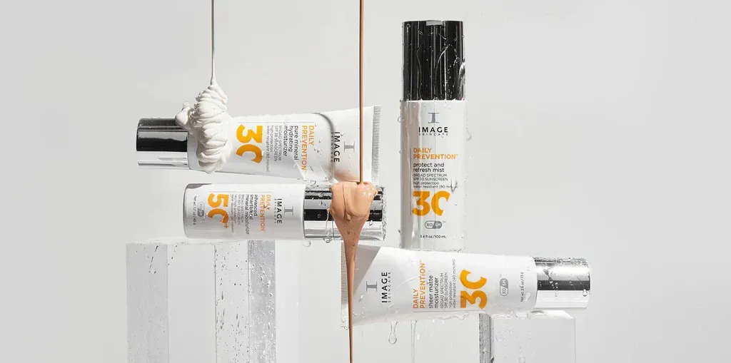 Skincare products with liquid textures dripping down, set against a white background.