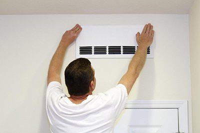 Person Installing Air Conditioner