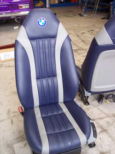 single blue car seat with white stripes
