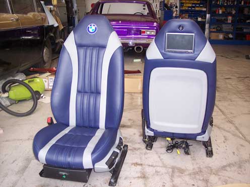 blue car seat with white stripes and back