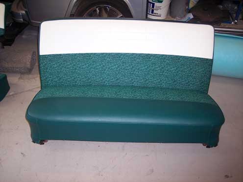 front of green and white car seat
