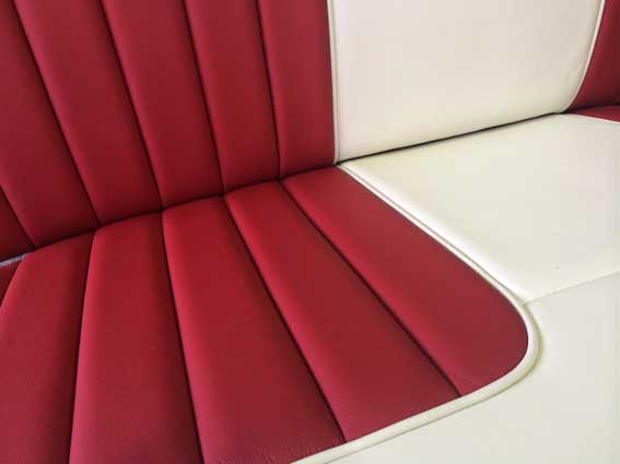 close up of red and white car seat material