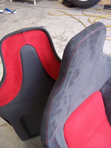 top of red and grey car seat
