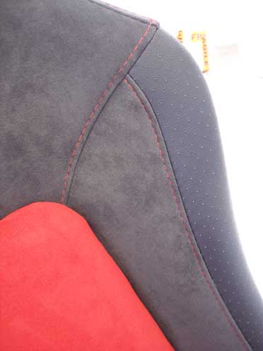 close up of grey and red car seat material