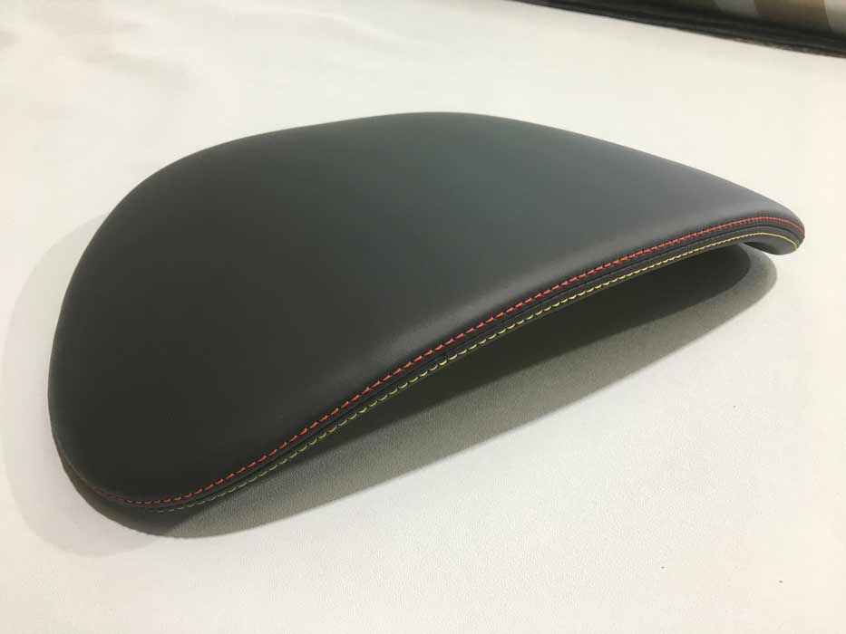 black leather seat with red stitching